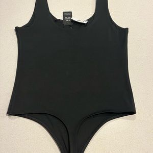 Body contour high compression body suit from Express. Brand New.